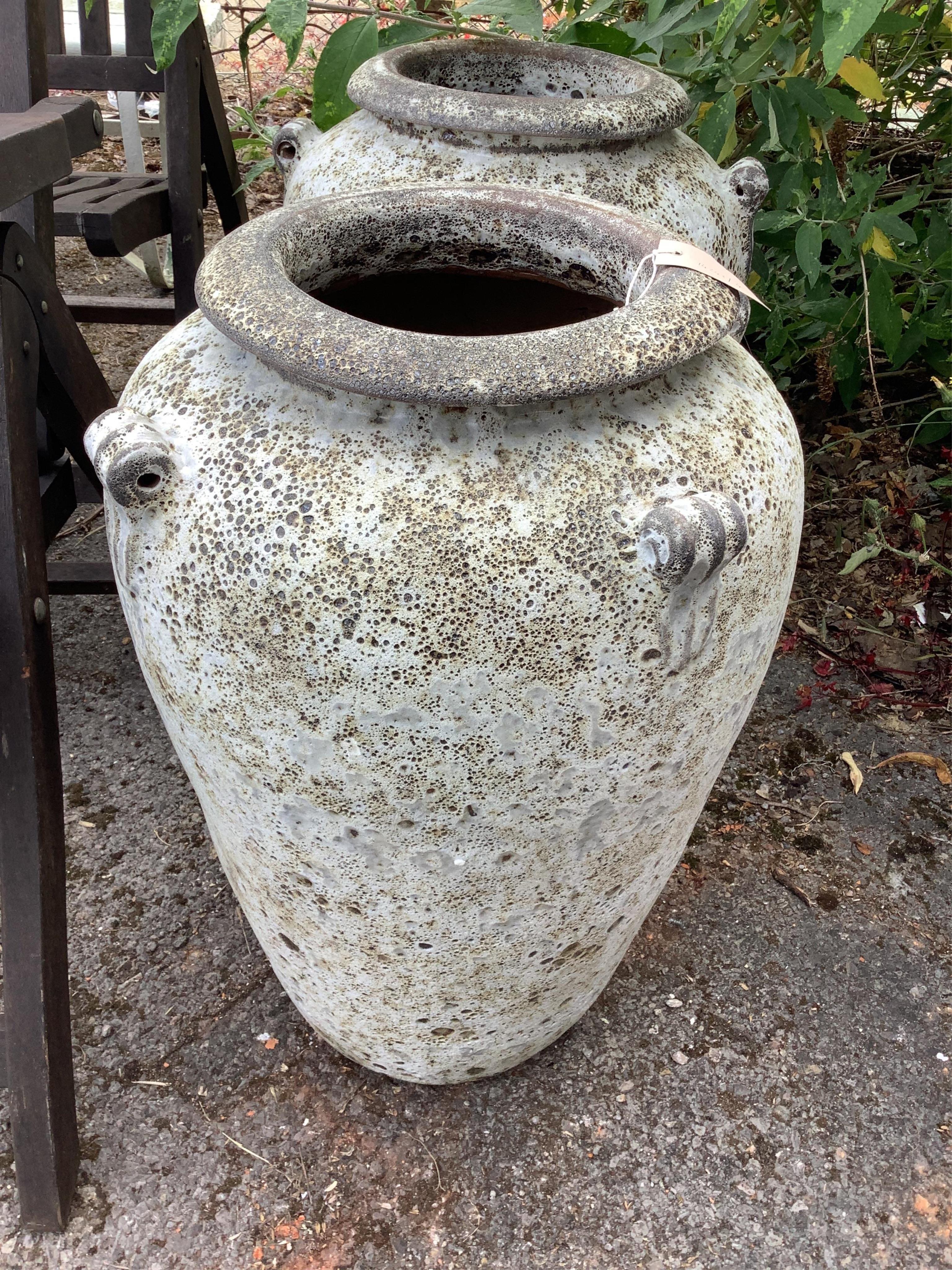 A pair of fire clay amphora urns, height 62cm. Condition - good